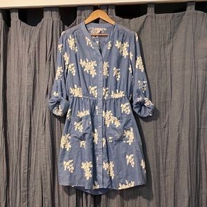 Button up denim dress with floral embroidery.